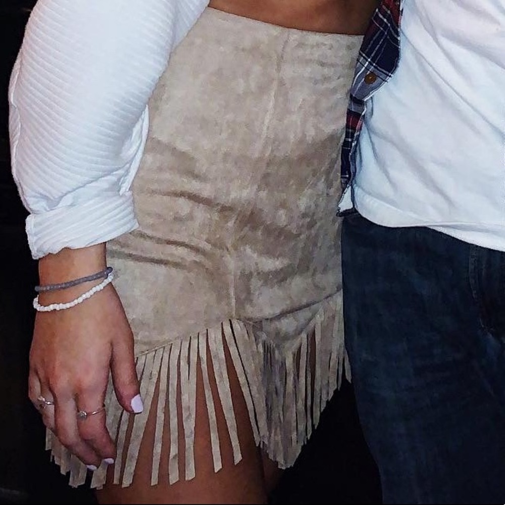 Suede tan fringe skirt size: small.